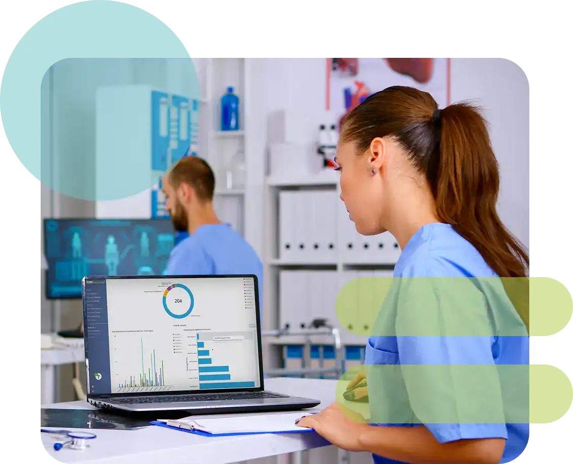 Healthcare professionals analyzing medical data on computer screens in clinic.