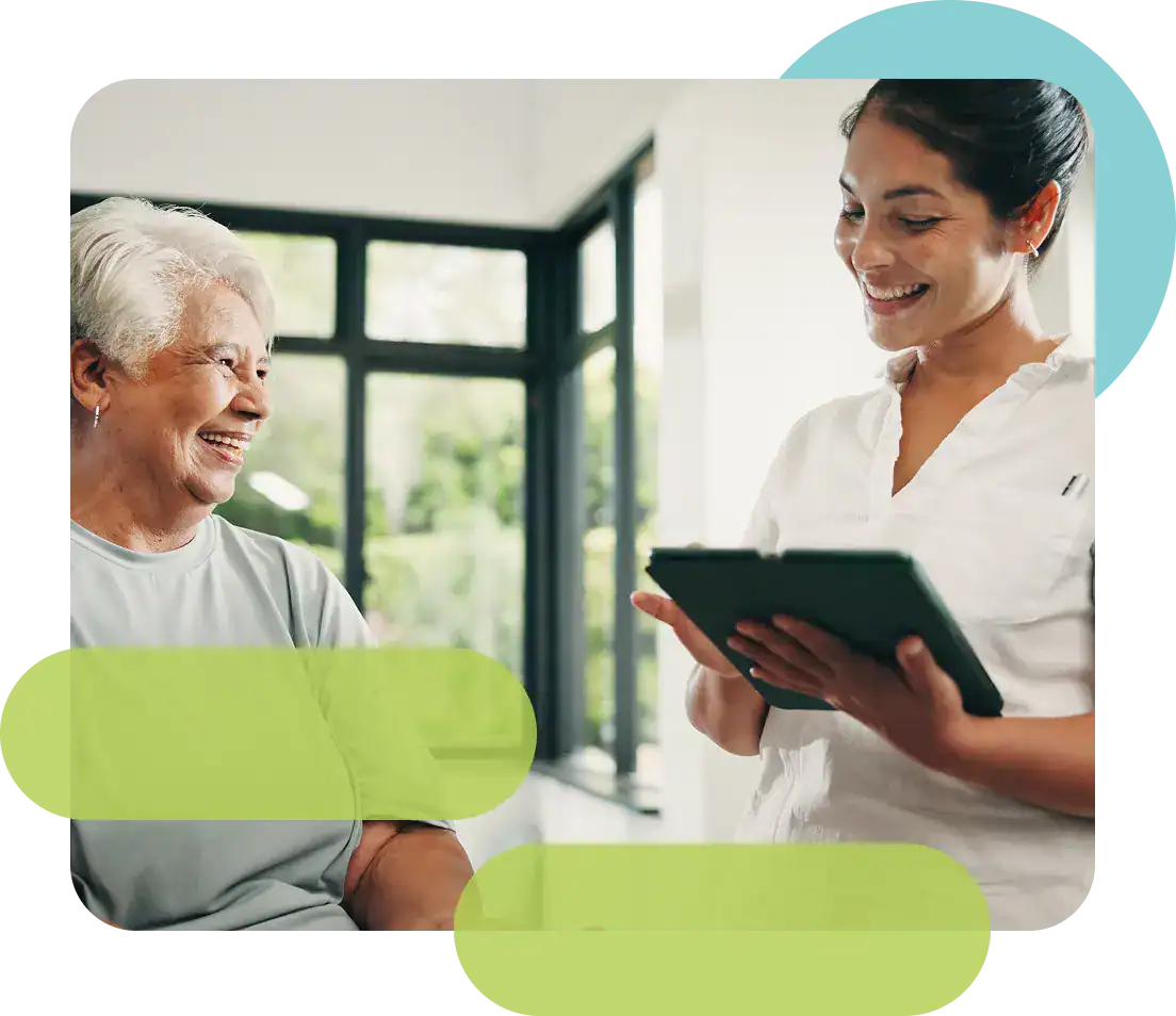 Healthcare professional consulting with elderly woman in a bright clinic.