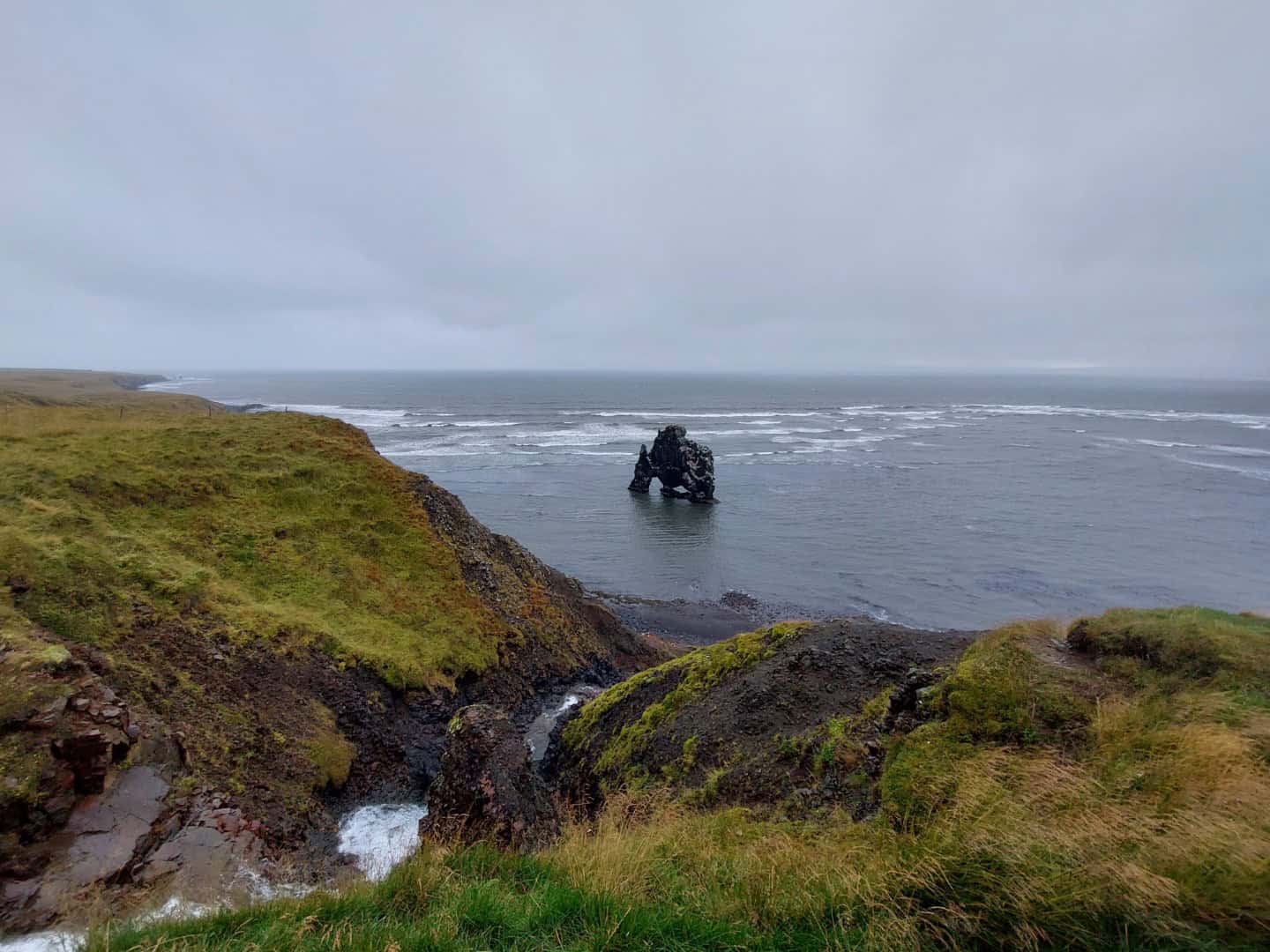 Unique sea stack along the Westfjords coast in Iceland.