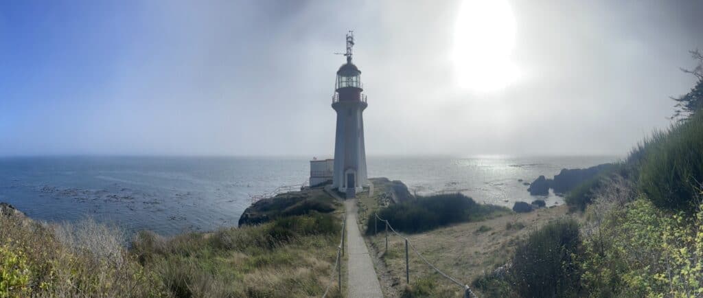 Scenic view of Cape Lazo Lighthouse overlooking the Pacific Ocean.