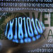 Verohallinon logo ja internetiä kuvaavaa futuristista grafiikaa.