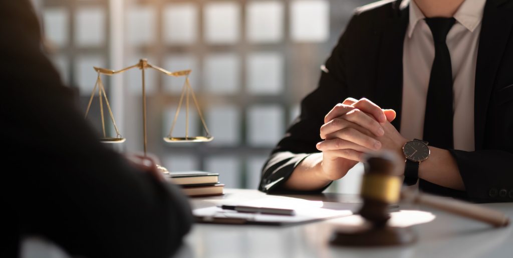 Working together as a Team. Lawyer is holding hands and listening.
