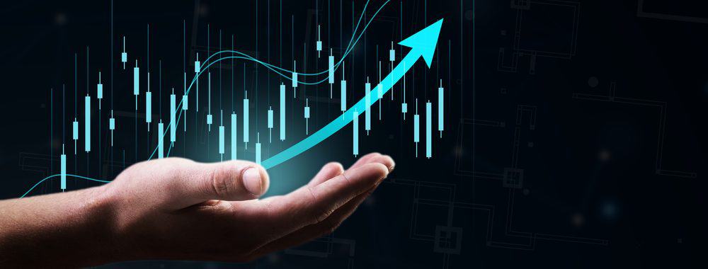 Upward arrow on top of graphs depicting stocks and shares investments
