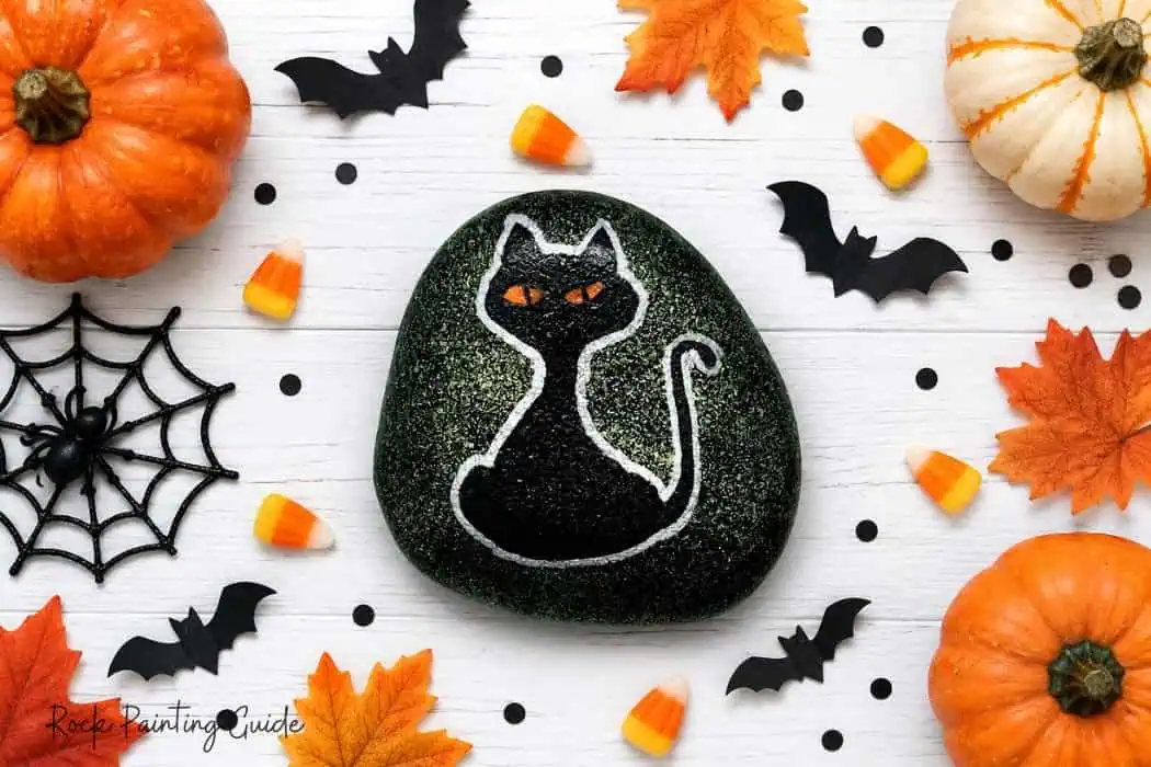 8 Easy Halloween Rock Painting Ideas for Kids 8 black cat painted rock