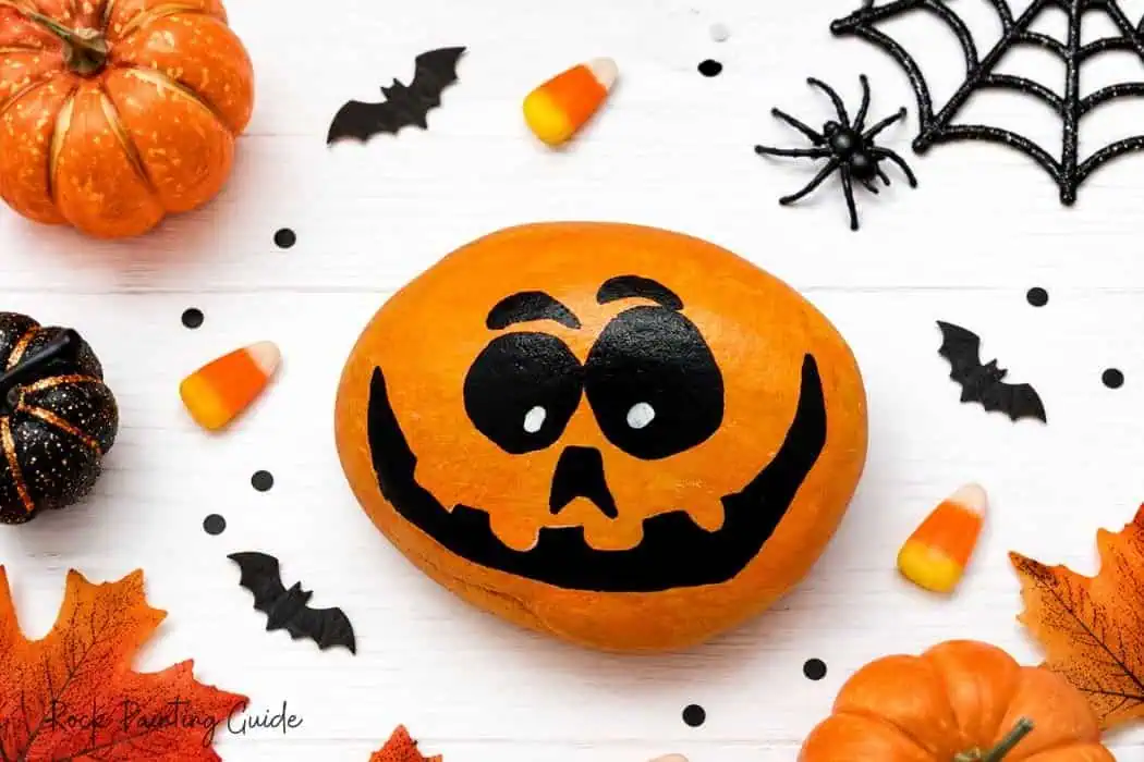 8 Easy Halloween Rock Painting Ideas for Kids 6 jackolantern painted rock