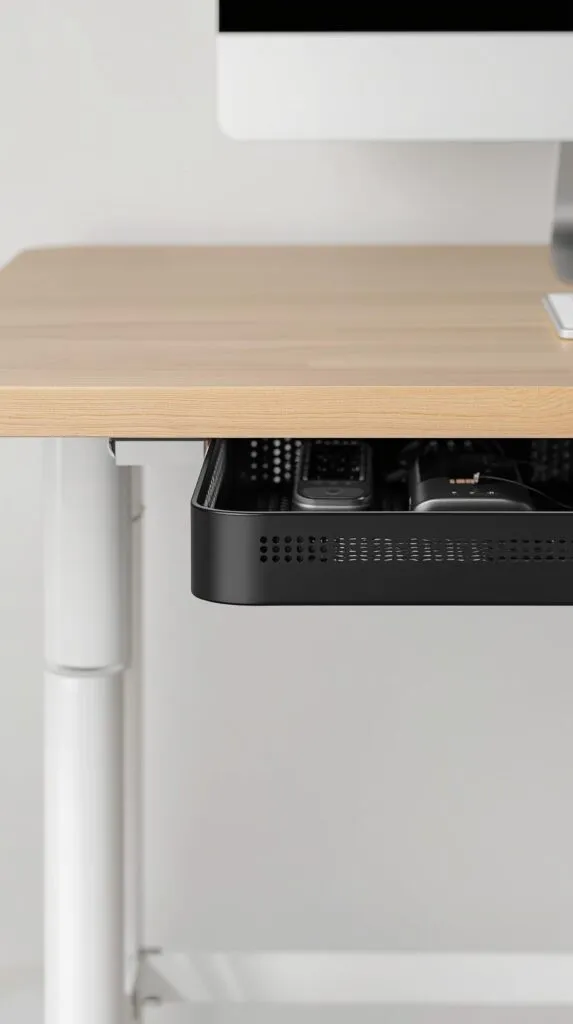  close up of a modern cable management tray securely mounted under a light wood desk