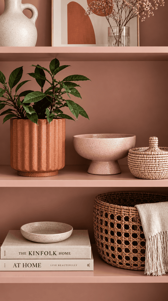 Soft pink and terracotta styled shelf decor for a non traditional fall look
