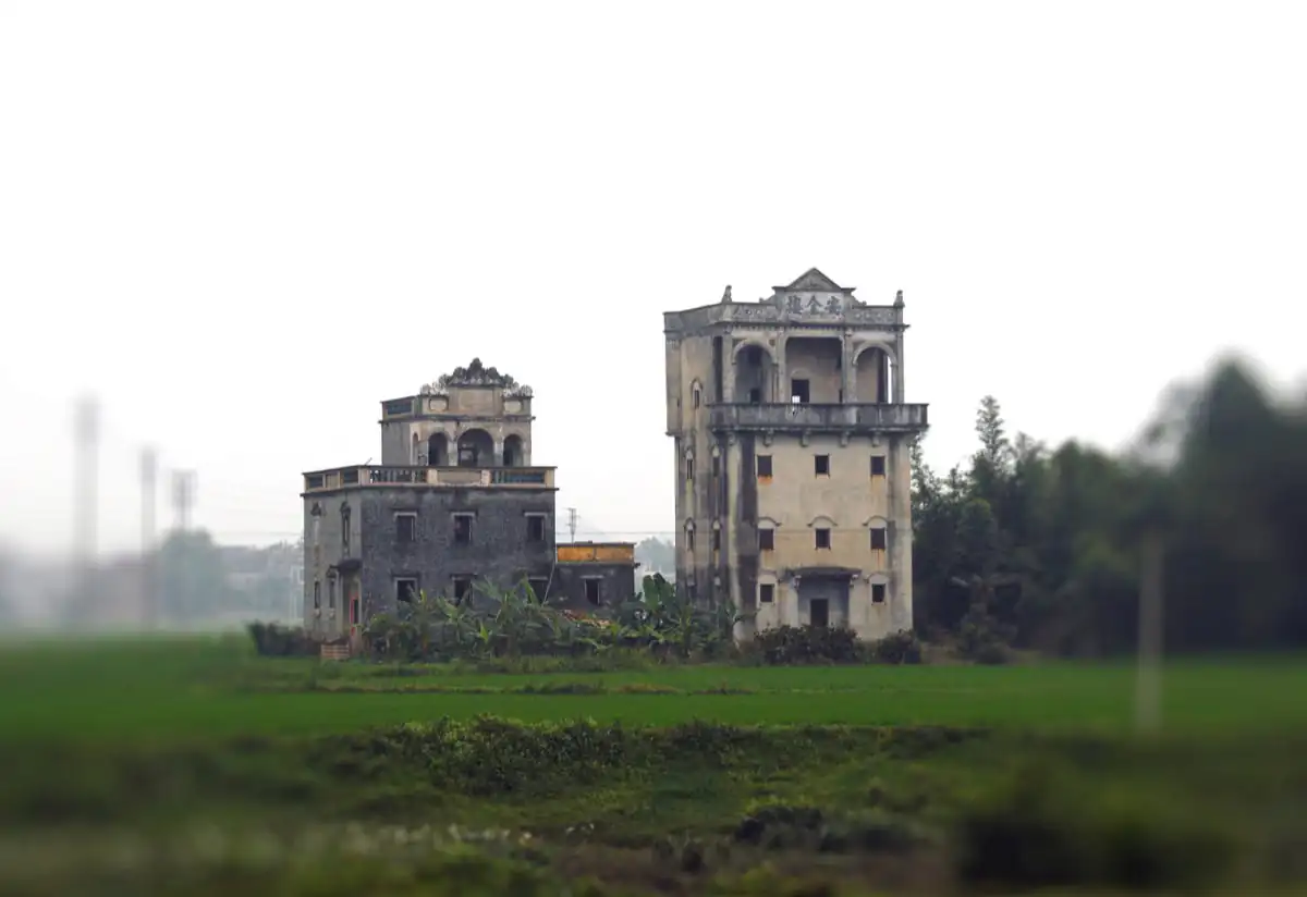 A historic Kaiping diaolou fortified watchtower in Guangdong, exemplifying the distinctive architectural heritage of the Wuyi region built by returned overseas Chinese in the early twentieth century.