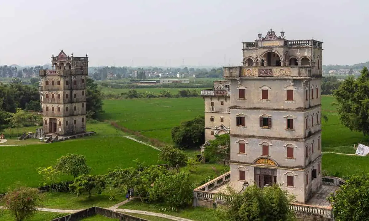 Yunhuan Lou and Qiuanjulu Mansion in Zili Diaolou Village, Tangkou Township, Kaiping — UNESCO World Heritage fortified towers built with remittance money delivered through the qiaopi system.