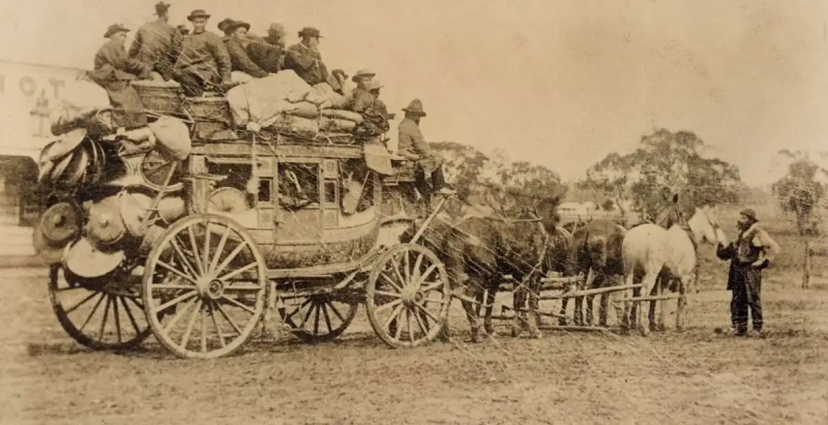 Cantonese miners panning for gold during the Australian gold rush, a group of Chinese men working a creek bed with mining tools