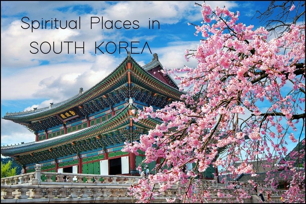 Spiritual Places in Asia A traditional Korean palace with intricate multicolored woodwork stands beside cherry trees in full bloom, under 'Spiritual Places in SOUTH KOREA'. The vibrant pink blossoms frame the scene, signifying spring and spiritual renewal.