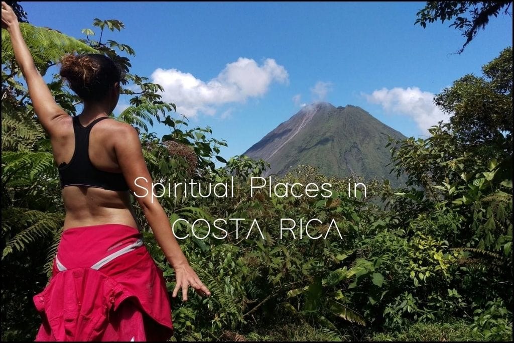 Discover Spiritual Places in the Soul of Central America A woman with her arm extended stands before the Arenal Volcano in Costa Rica, surrounded by lush tropical greenery, signifying a connection with nature. 'Spiritual Places in COSTA RICA' hints at exploring the country's tranquil and healing landscapes.