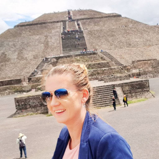 Your 2026 Spiritual Guide to The Pyramids of Teotihuacan Picture of a woman standing in front of The Pyramids of Teotihuacan.