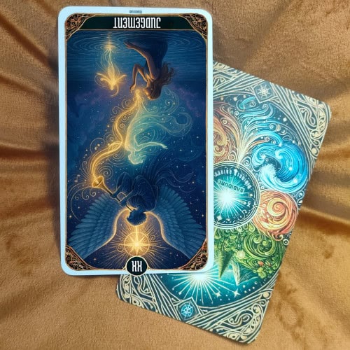 The Judgement Tarot Card Meaning - 20 Major Arcana Tarot Card Meanings The Judgement Tarot Card reversed version showing the same angel with large wings and trumpet, but positioned upside down. The divine light, celestial symbols, clouds, and figures rising from the water are still present but inverted, symbolizing the reversed meaning of the card.