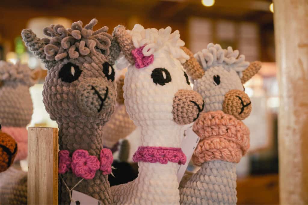 What the Alpaca Spirit Animal Reveals About You Handmade crocheted alpaca dolls in soft colors, reflecting how the alpaca spirit animal inspires warmth, gentleness, and community connection.