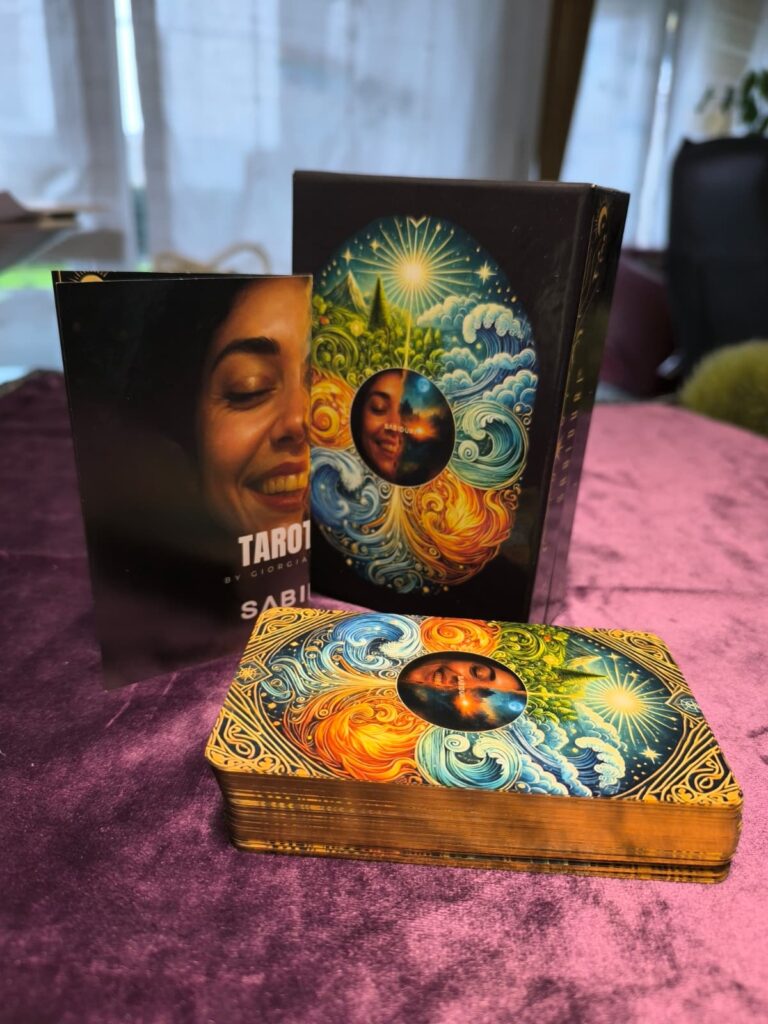 Tarot deck by Giorgia displayed with box and guidebook on velvet cloth, representing the structured system side of Oracle vs Tarot.
