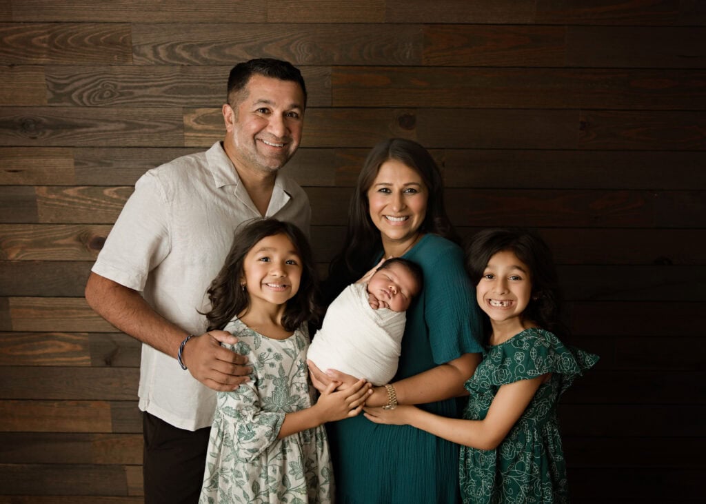 Family Portrait with newborn baby and his two older sisters
