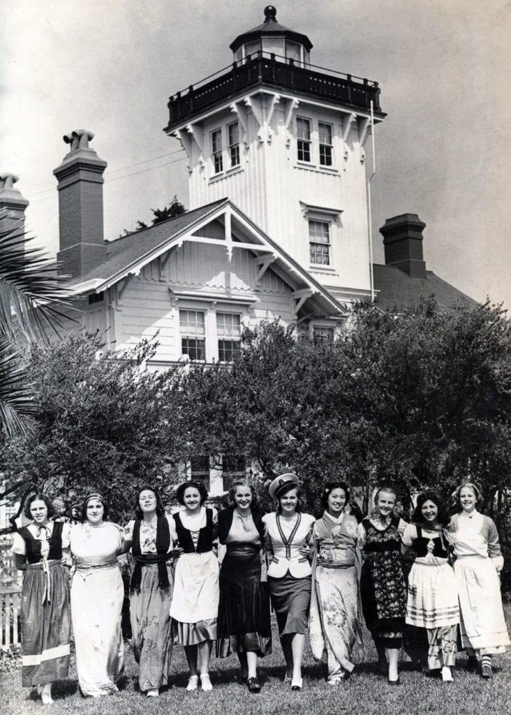 Undated photo of women in various traditional cultural dress outside Point Fermin Lighthouse. (photo: courtesy San Pedro Bay Historical Society)