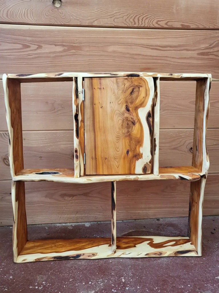 Shelves and small cupboard made with live edge yew - showing highly contrasting heartwood and sapwood