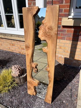 A mirror with two burry live edge elm pieces, one on each side - sent by a customer