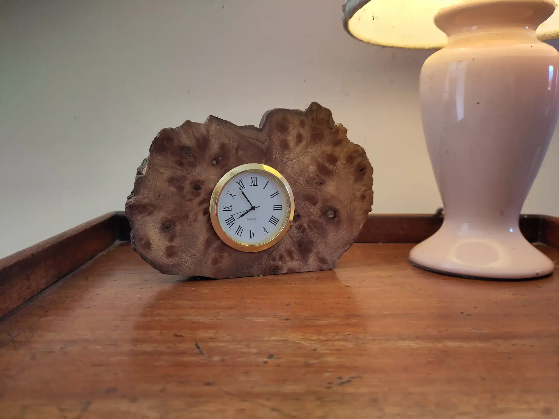 A small clock inset into a small elm burr, an ideal starter woodworking draft project