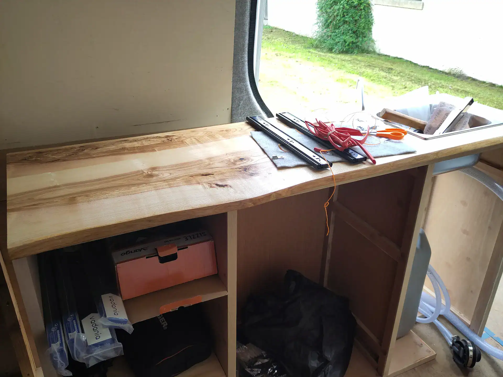 Live edge worktop made from Scottish Ash for a camper van converted kitchen