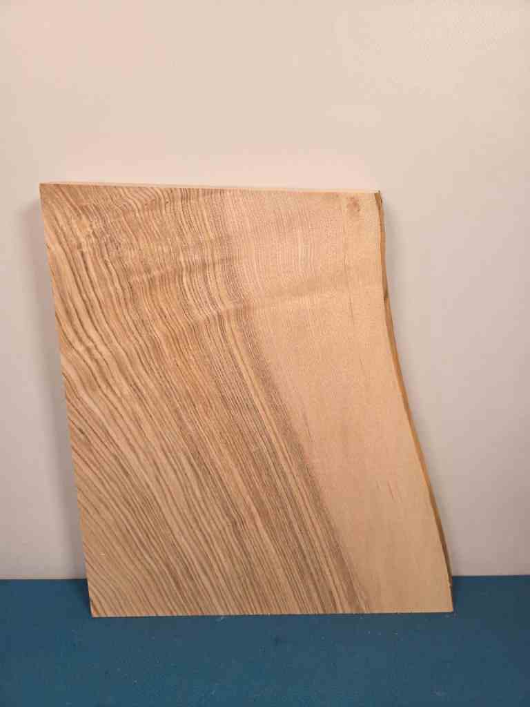 Chunky ash offcut with natural wood grain and smooth surface.