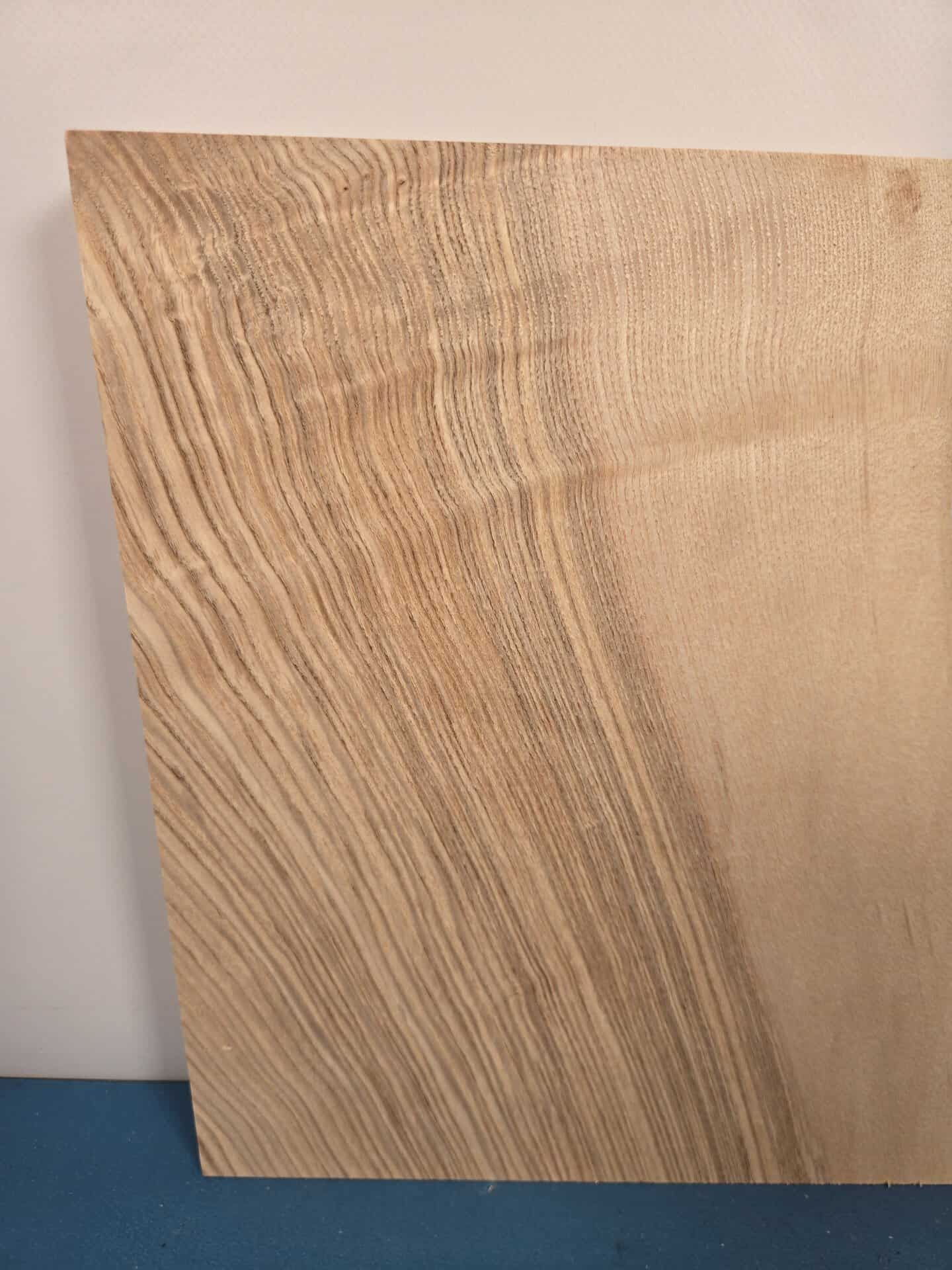 Chunky ash offcut showing natural wood grain and smooth planed surface.