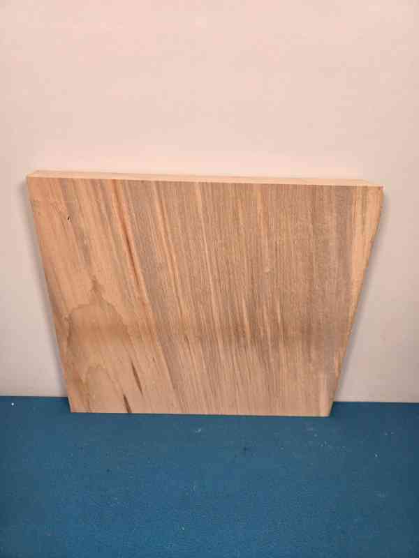 Single Beech offcut with smooth planed surface and natural wood grain.