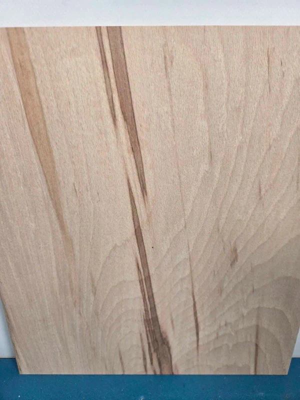 Colour streaked beech offcut showing natural wood grain and colour variations.