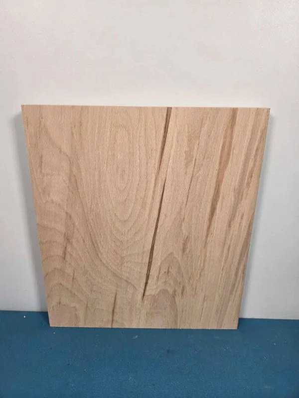 Colour streaked beech offcut with natural wood grain and smooth surface.