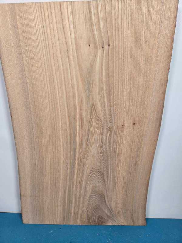 Clean Elm offcut showing natural wood grain and smooth surface.