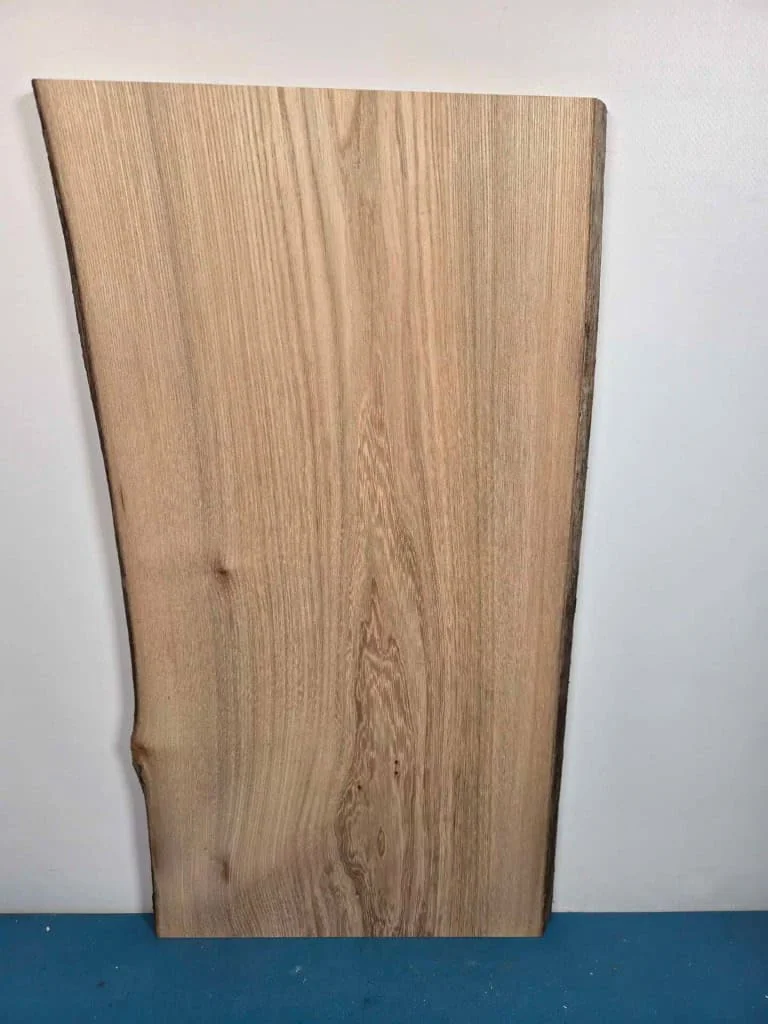Straight grain Elm offcut showing natural wood texture and light colour.