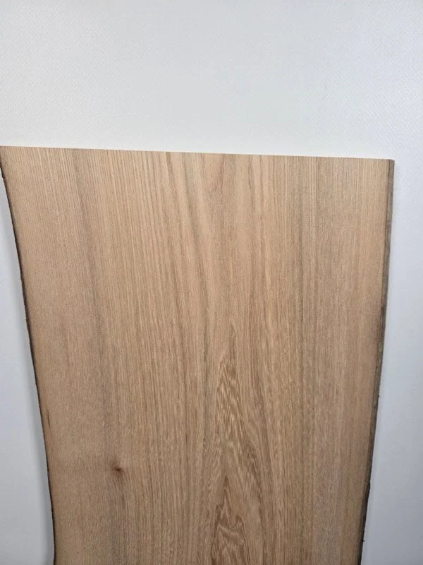 Straight grain Elm offcut showing smooth timber surface and natural wood colour.