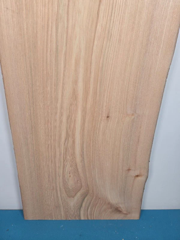 Straight grain Elm offcut showing smooth surface and natural wood colour.
