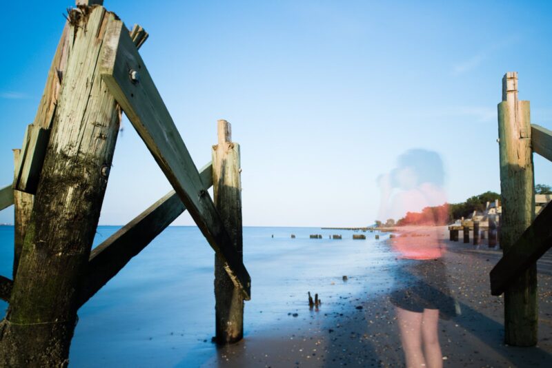 10 Ways to Improve Your Long Exposure Photography Woman on beach dock