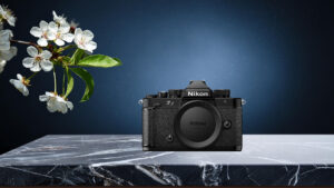 Nikon Z camera on marble with cherry blossoms.