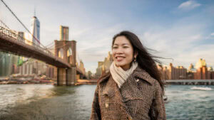 Smiling woman near Brooklyn Bridge, New York City