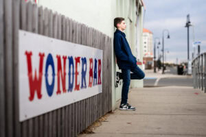 Teen leaning against wall at Wonder Bar