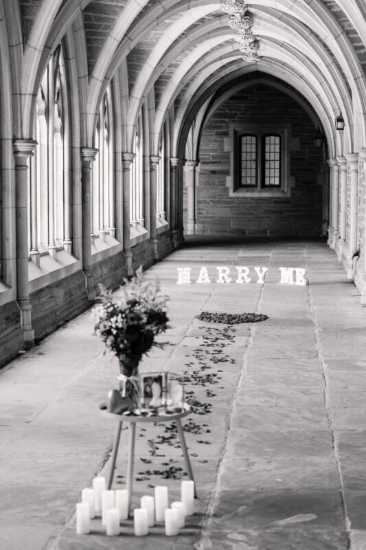 The Perfect Black & White Photo Editing Style Romantic proposal setup in historic archway.