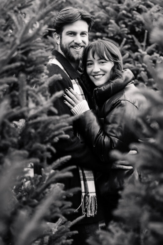 Achieve Sharp and Crisp Monochrome Photos Smiling couple embraces in forest setting