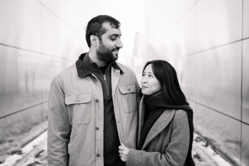 The Perfect Black & White Photo Editing Style Couple smiling warmly in black-and-white photo outdoors.