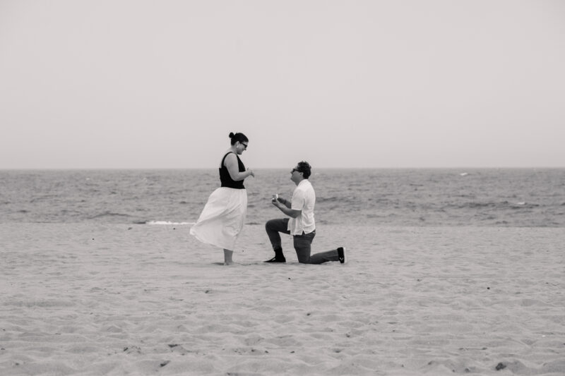 The Perfect Black & White Photo Editing Style Beach proposal with man kneeling