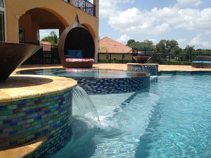 professionally cleaned pool with pool features in florida homes