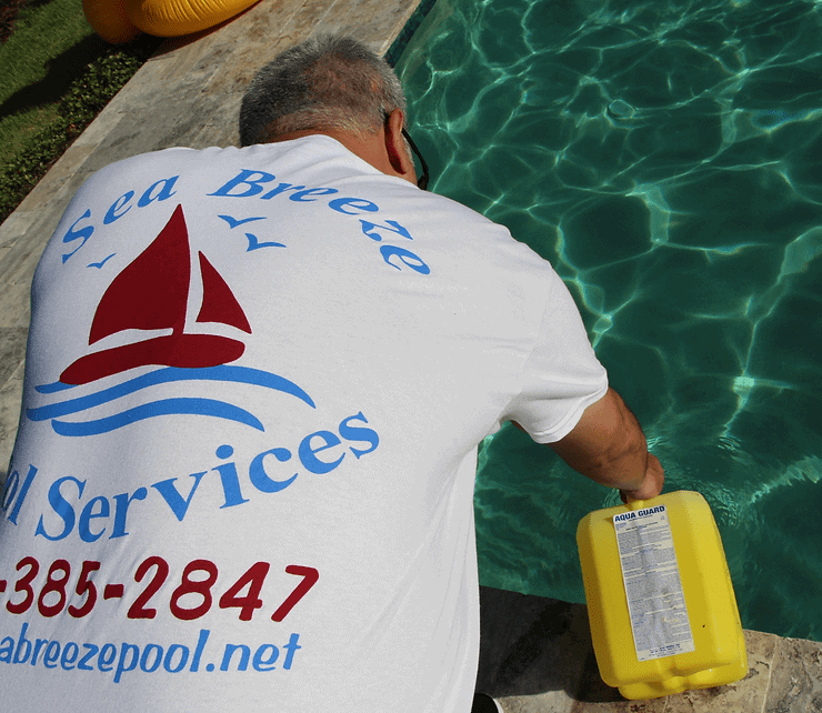 man adding bleach in pool