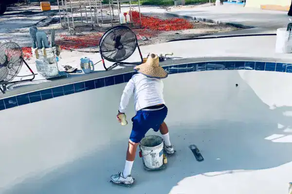 Worker doing work for a pool repair cost in Orlando