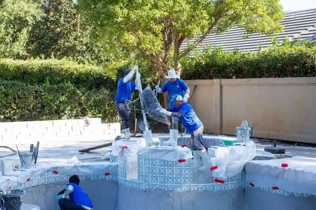 Pool workers fixing a hot tub in Orlando to work with pool chemistry.