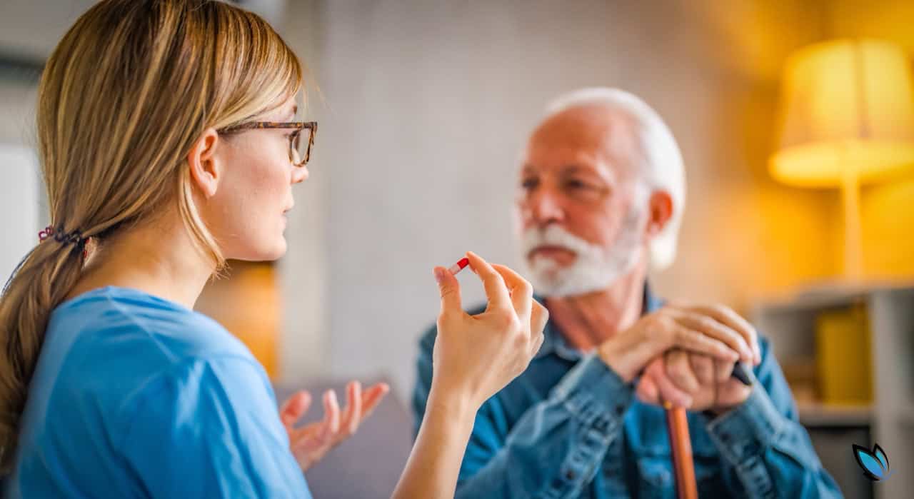 Caregiver ready to administer medication to a senior resident in the senior living community