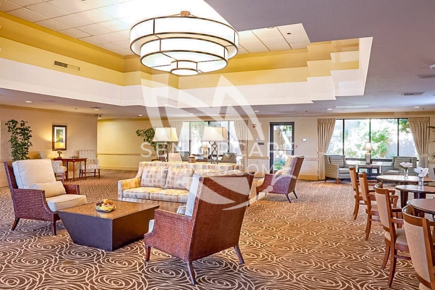 Spacious, modern lounge with seating at The Carlotta Ivy Park.
