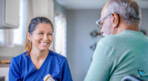 Assisted Living nurse helping senior resident with his medication